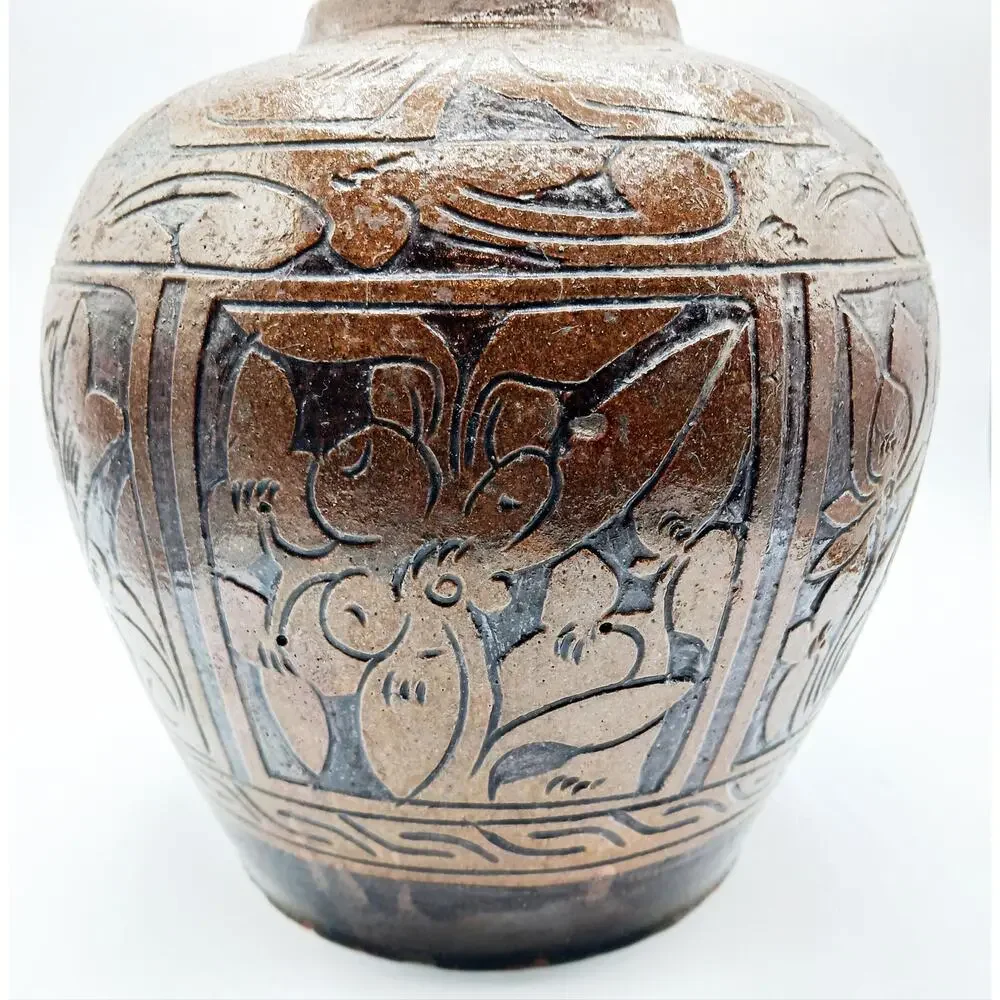 Vintage Asian Pottery Jar featuring designs of Fish, Bird, and Flowers